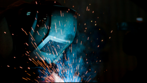 A welder with sparks flying.